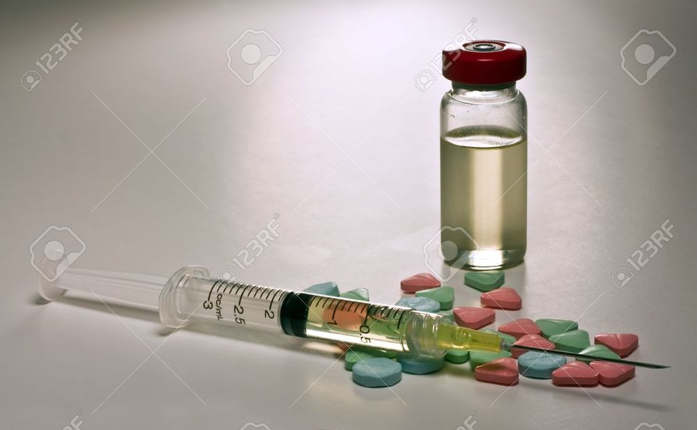 5672104-Assorted-group-of-steroids-with-needle-syringe-and-pills-Stock-Photo.jpg