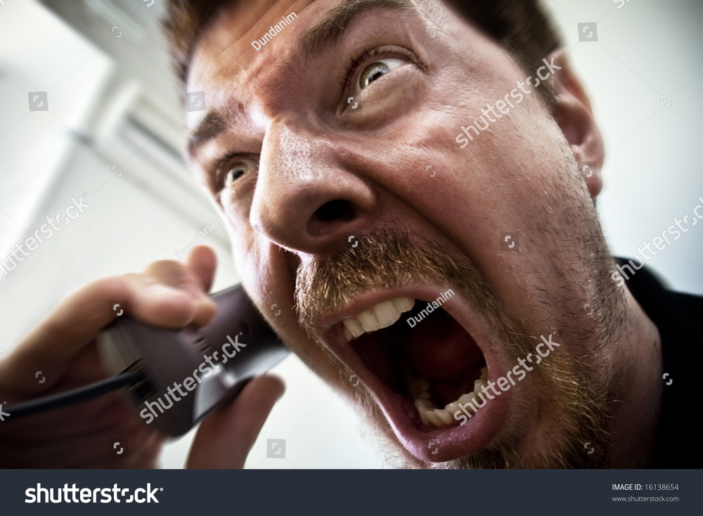 stock-photo-stressed-stock-broker-screaming-on-the-phone-16138654.jpg